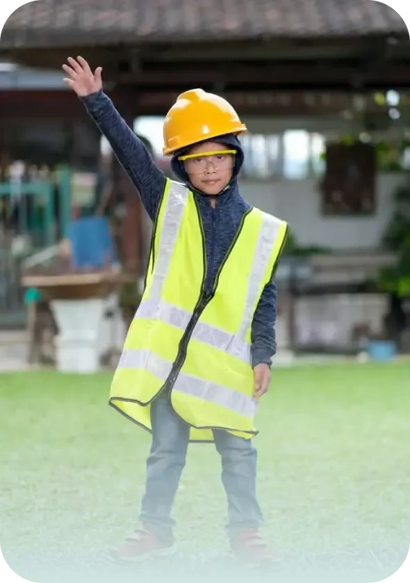 This is a picture of a little boy in a safety vest