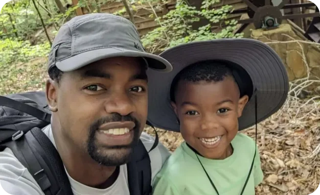 Jermaine and J posing at a campout at Anne Springs Close Greenway. This picture ended up on the cover of a magazine about our company